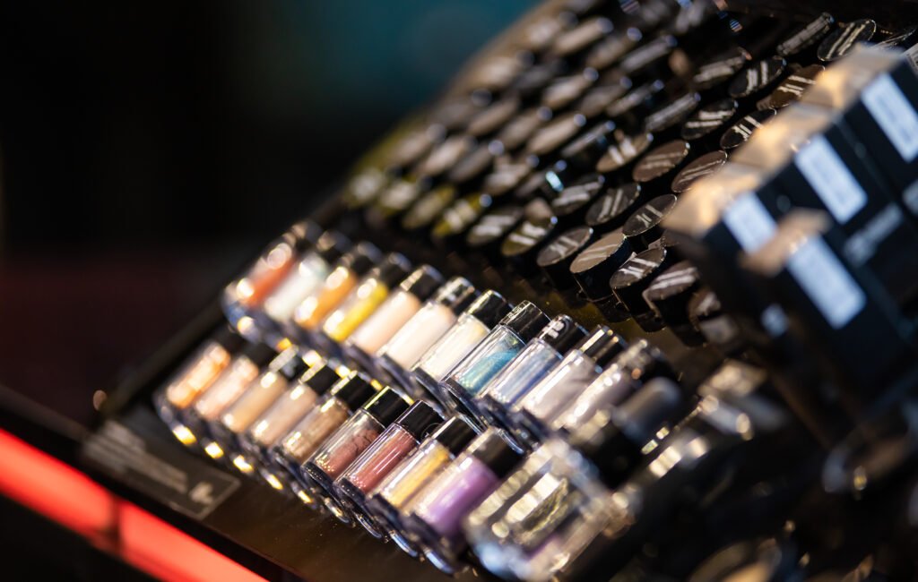 Set of cosmetics on shelves in beauty store